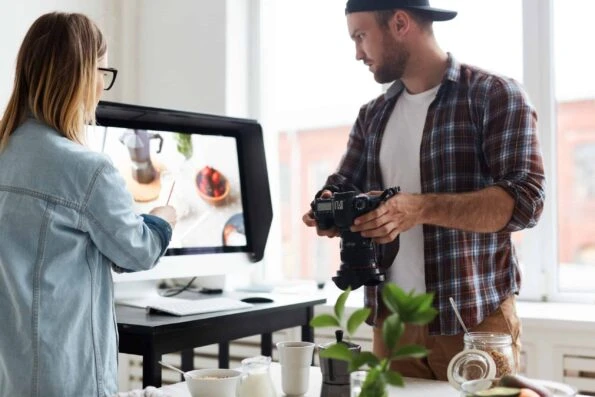 alt="content creators carefully planning their visual elements for their post in preparation for publication"